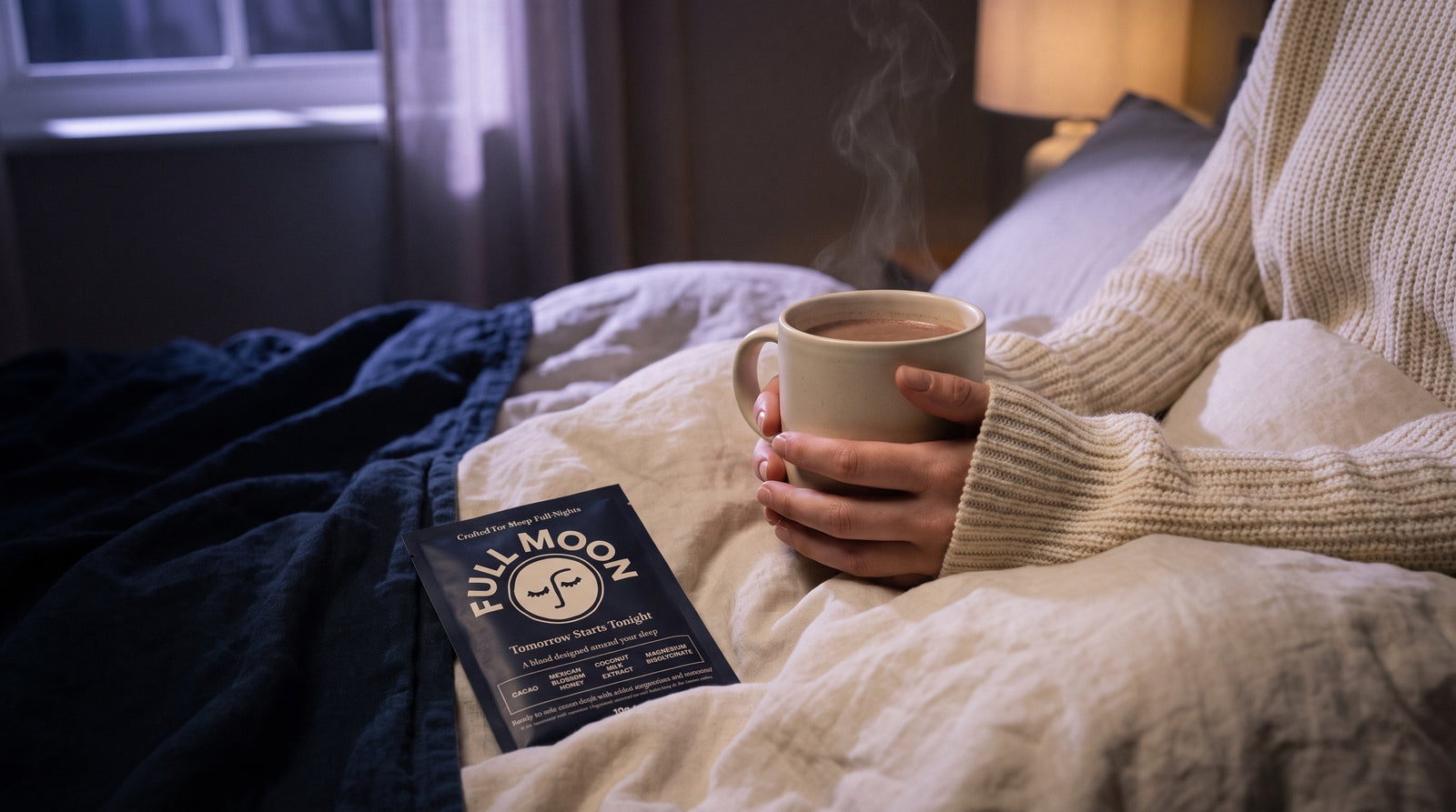 Holding a warm mug in bed