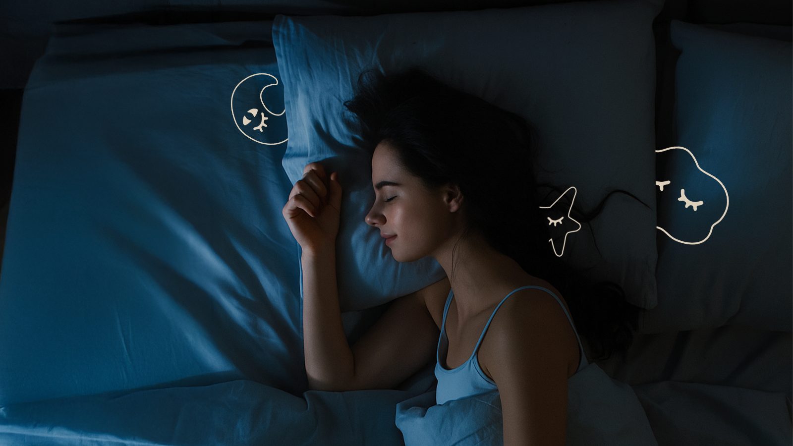 A woman asleep in a moonlit bedroom
